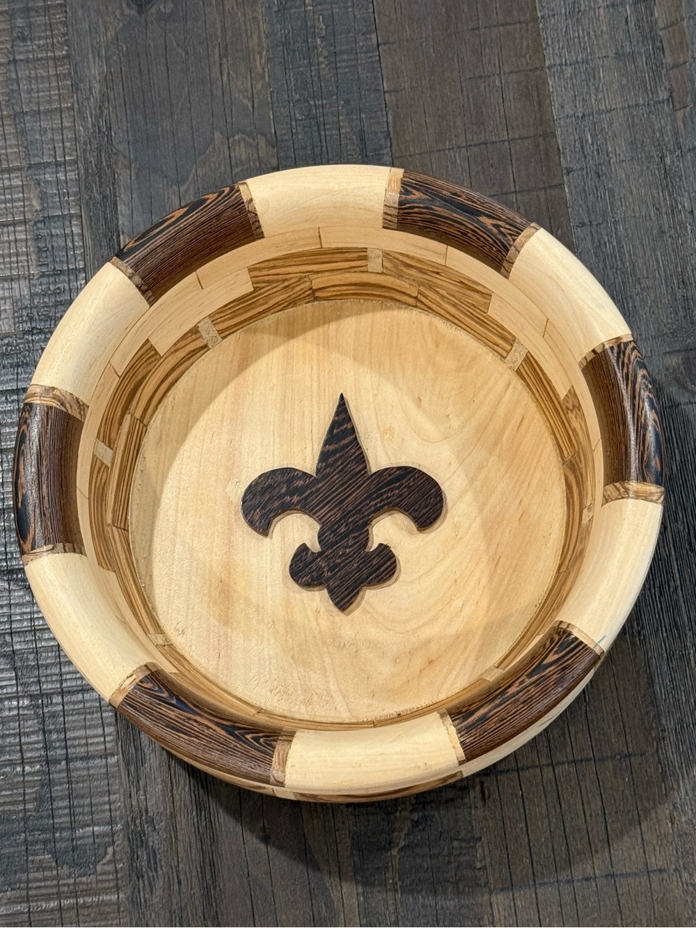 Handcrafted Segmented Wood Bowl Featuring Fleur-de-Lis Inlay